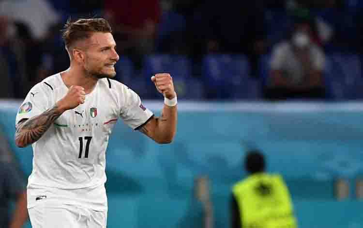 Striker Italia Ciro Immobile merayakan golnya ketika Italia menang 3-0 atas Turki dalam laga perdana UEFA EURO 2020 di Stadion Olimpiade, Roma, 11 Juni 2021