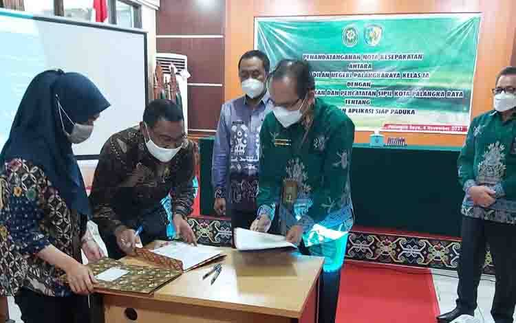 Pengadilan Negeri dan DPPKBP3A Palangka Raya MoU Pendampingan Kasus Anak dan Perempuan