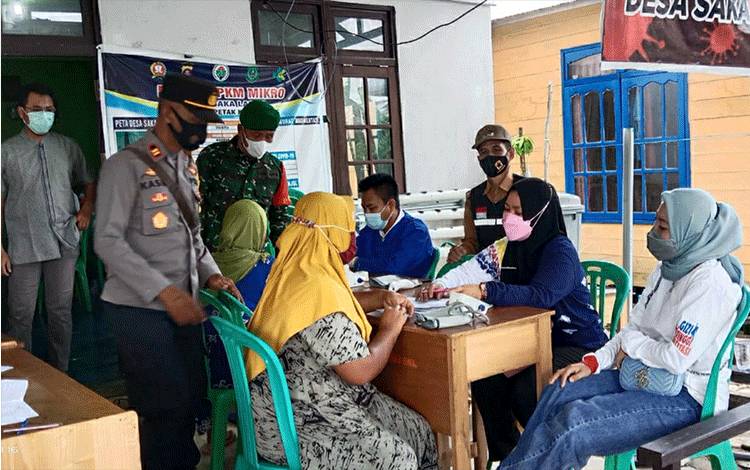 Monitoring Vaksinasi Covid-19 di Desa Saka Lagun, Ini Pesan Camat Pulau Petak