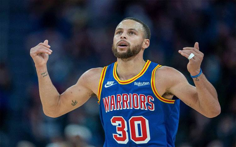Guard Golden State Warriors Stephen Curry ketika bertanding melawan Memphis Grizzlies di Chase Center, San Francisco, California, Amerika Serikat, 23 Desember 2021. (REUTERS/USA TODAY Sports/Neville E. Guard)
