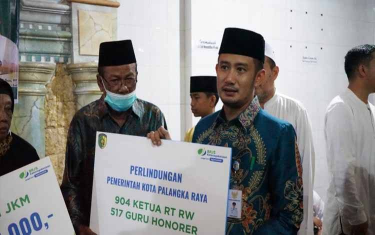 Pemko Palangka Raya Lindungi 904 Ketua RT/RW dan 517 Guru Honorer Lewat BPJS Ketenagakerjaan