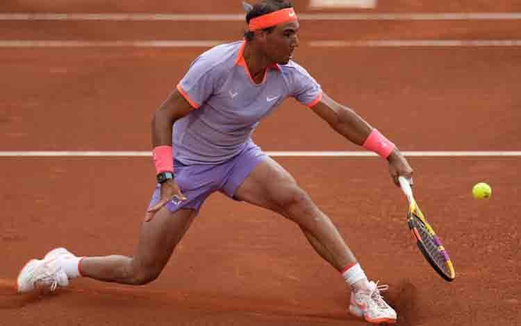 Petenis Spanyol Rafael Nadal. (Photo by Pau BARRENA / AFP) (AFP/PAU BARRENA)