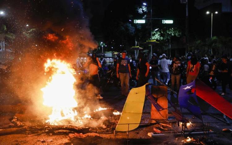 Aksi protes terhadap kemenangan kembali Presiden Venezuela Nicolas Maduro untuk masa jabatan ketiga di Caracas/HO-Anadolu/www.aa.com.tr