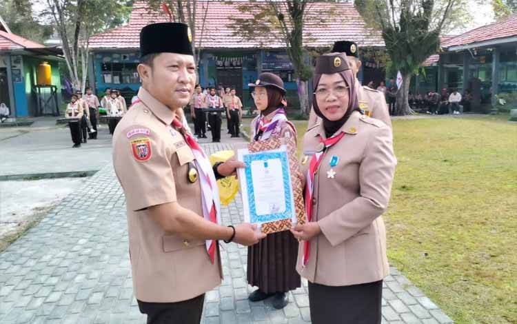 Kwartir Ranting Gerakan Pramuka Baamang Gelar Apel Besar Peringati HUT Pramuka ke 63