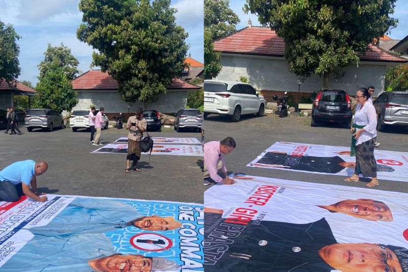 Dua tim kampanye paslon Pilkada Bali tandatangani APK baliho persetujuan KPU Bali di Denpasar, Kamis (3/11/2024). ANTARA/Ni Putu Putri Muliantari