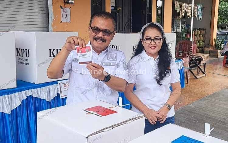 Pj Bupati Gunung Mas Gunakan Hak Pilih di TPS 6 Tampang Tumbang Anjir