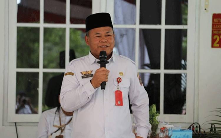 Plh Asisten Pemkesra Setda Prov Kalteng Maskur saat menyampaikan sambutannya. (FOTO:ASEP)